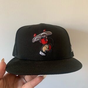 Disney black hat featuring Mickey Mouse on a skateboard upside down